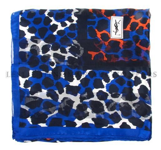 An Yves Saint Laurent Silk Scarf, 54 x 54 inches.: An Yves Saint Laurent Silk Scarf, in a leopard motif. Labeled within print: Yves Saint Laurent. 54 x 54 inches.
