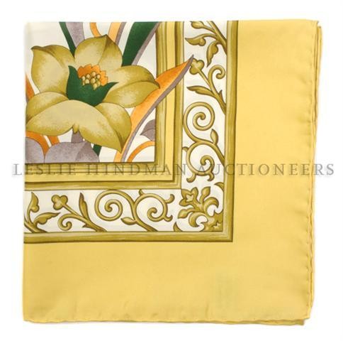 A Ferragamo Silk Scarf, 35 x 35 inches.: A Ferragamo Silk Scarf, in a floral motif. Labeled within print: Ferragamo. 35 x 35 inches.