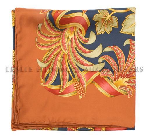 A Ferragamo Silk Scarf, 35 x 35 inches.: A Ferragamo Silk Scarf, in a floral motif. Labeled within print: Ferragamo. 35 x 35 inches.