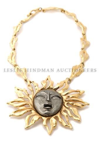 A Kenneth Jay Lane Oversized Sun Pendant Necklace,: A Kenneth Jay Lane Oversized Sun Pendant Necklace, with a steel face at center. Stamped: Kenneth Lane. Length of pendant 4 inches.