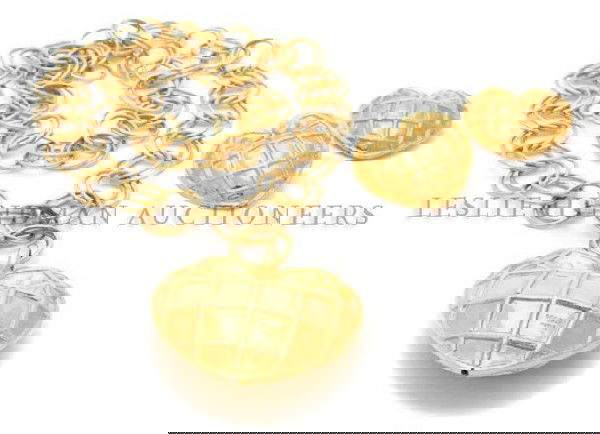 A Rochas Goldtone Heart Suite,: A Rochas Goldtone Heart Suite, 1980s, comprised of a necklace and matching earclips. Stamped: Rochas.