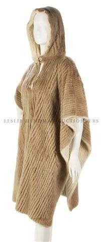 A Tan Ribbed Mink Poncho,: A Tan Ribbed Mink Poncho, reversible to white mink. Property from the Estate of Eunice Johnson, Chicago, Illinois