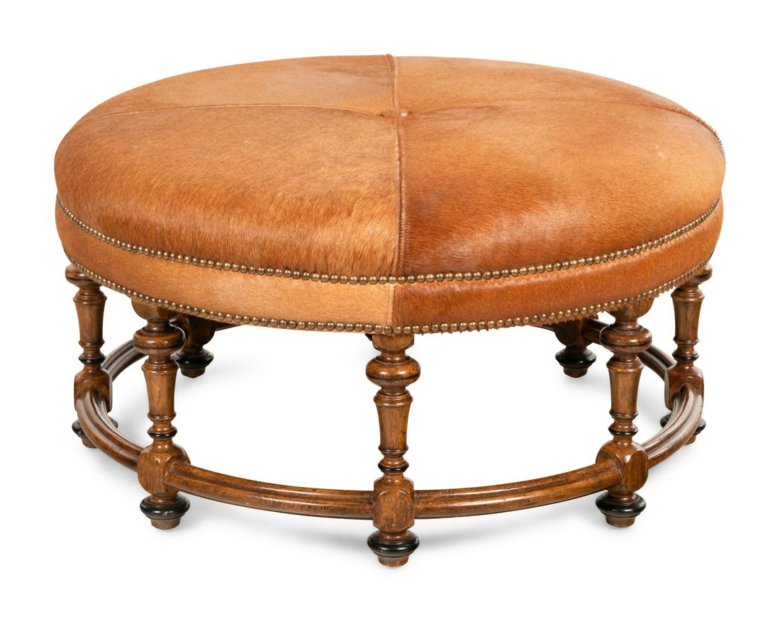 A William and Mary Style Oak Ottoman with Haircalf: A William and Mary Style Oak Ottoman with Haircalf Upholstery 20th Century Height 19 x diameter of top 35 1/4 inches.