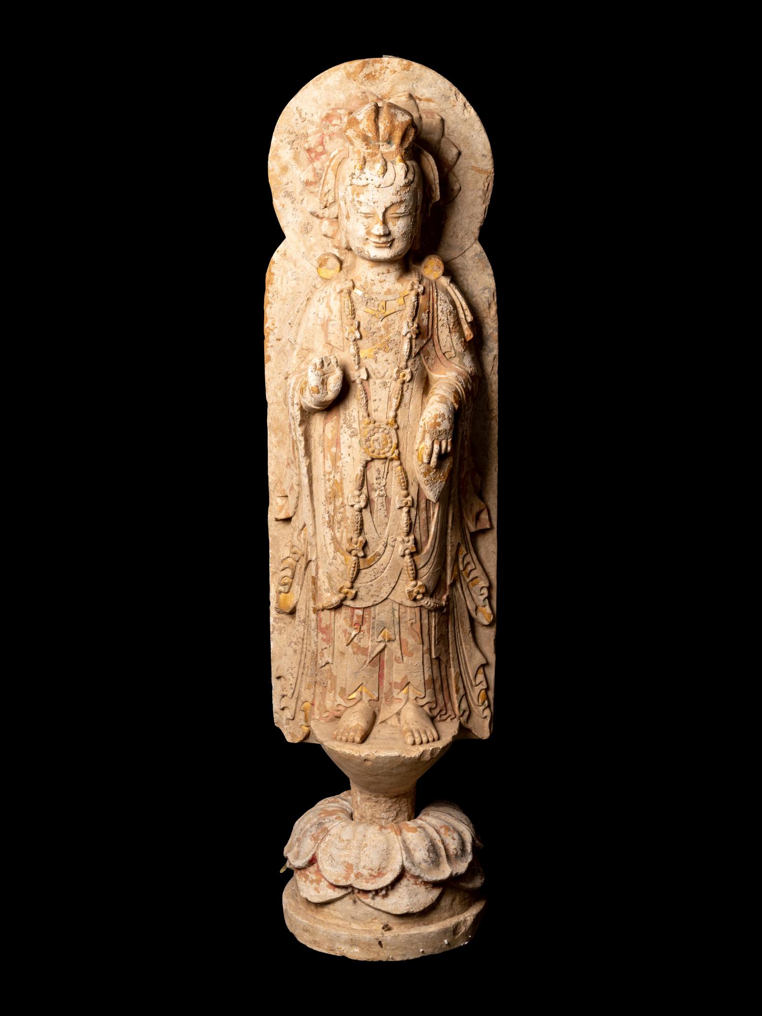 A Chinese Carved Stone Standing Buddha with Remnants of (1 of 4)