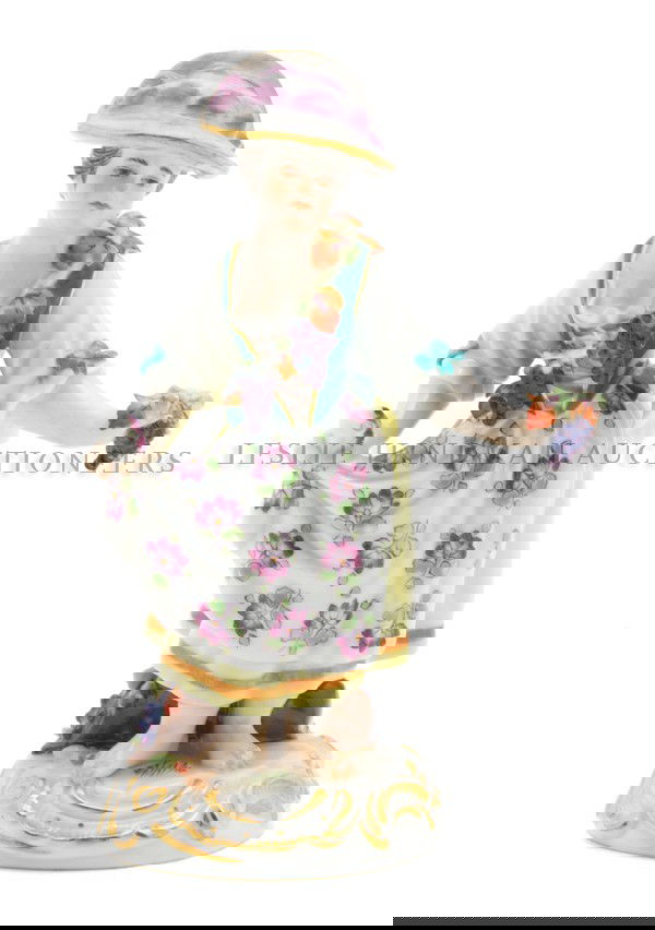 A Meissen Porcelain Figure, Height 4 3/4 inches.: A Meissen Porcelain Figure, 19th century, depicting a girl with grapes, impressed 1186, having crossed swords mark in underglaze blue. Height 4 3/4 inches. Property from the Estate of Richard J. Schad