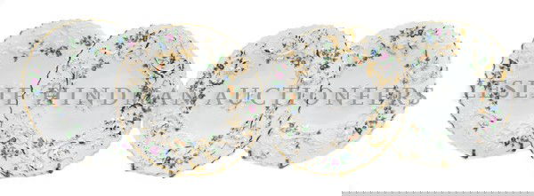 A Set of Four Meissen Porcelain Dessert Plates, Di: A Set of Four Meissen Porcelain Dessert Plates, each with scalloped gilt edge and raised polychrome floral decoration, having crossed swords mark in underglaze blue. Diameter 8 1/2 inches.