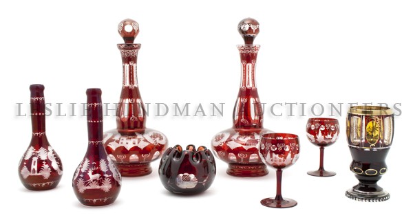 A Collection of Eight Red Bohemian Cut-Glass Artic: A Collection of Eight Red Bohemian Cut-Glass Articles, comprising two decanters, two barber bottles, two goblets and two vases. Height of tallest 14 1/4 inches. Property from the Estate of Ruth Rapfog