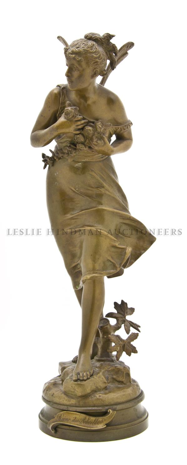 A French Bronze Sculpture of a Lady, Bouret (1833-: A French Bronze Sculpture of a Lady, Bouret (1833-1906), depicting a standing lady clutching flowers to her chest with wind swept dress, raised atop a naturalistic circular base, inscribed Rene des Ab