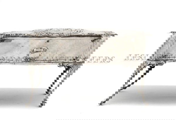 An English Silver Table Casket, William Crips, Hei: An English Silver Table Casket, William Crips, London, 1781, the rectangular and shaped top having a central figural scene within a cartouche, the whole having a Rococo border over the bow front friez