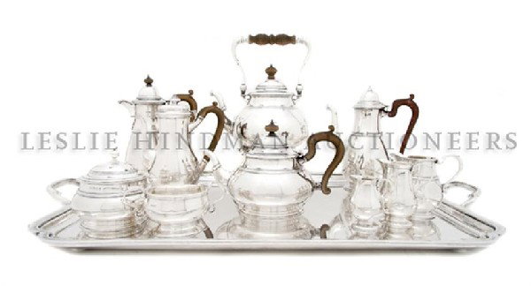 An Assembled English Silver Tea Service, Lionel Al: An Assembled English Silver Tea Service, Lionel Alfred Crichton, 1920-1923, London, comprising a teapot, chocolate pot, coffee pot, kettle on stand, creamer, waste bowl and a sugar lid, together with 