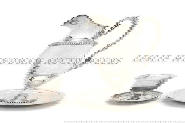 A Collection of American Sterling Silver Articles,: A Collection of American Sterling Silver Articles, comprising a Fisher Pitcher, an International cocktail bowl in the Wedgwood pattern and a Reed & Barton charger; approximate total weight 40.87 ozt.