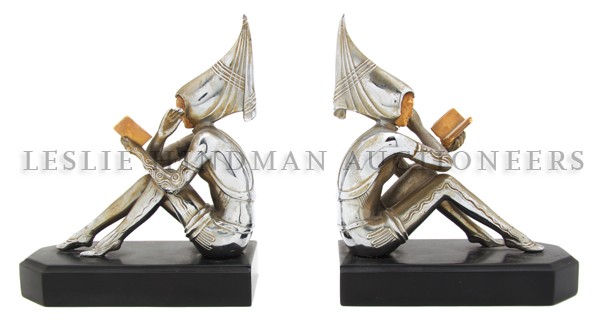 A Pair of Art Deco Bookends, Height of figures 6 : A Pair of Art Deco Bookends, depicting maidens reading books. Height of figures 6 5/8 inches. Property from the Estate of Robert S. Wells, Oak Park, Illinois