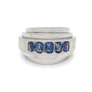 SUZANNE BELPERRON, PALLADIUM, YELLOW GOLD AND SAPPHIRE: SUZANNE BELPERRON, PALLADIUM, YELLOW GOLD AND SAPPHIRE 'STEPPED MODEL' RING Consisting of three concentric palladium bands containing five oval and cushion mixed cut sapphires, with yellow gold interi