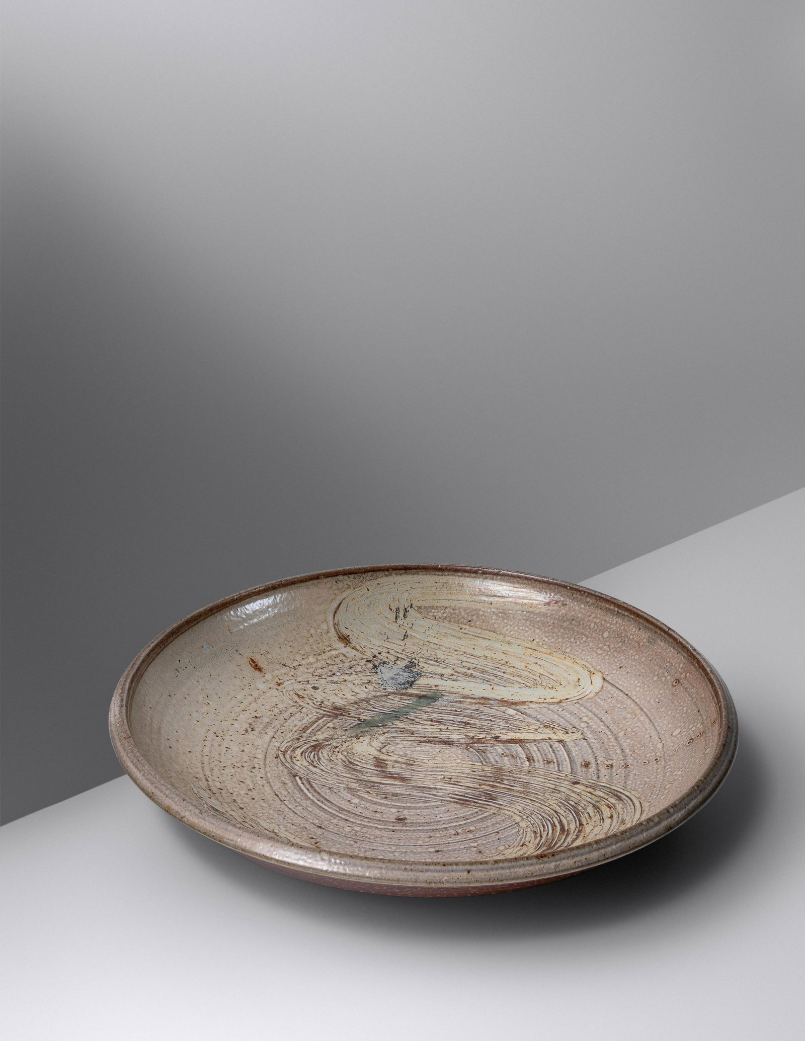 Don Reitz (American, 1929-2014) Charger: Don Reitz (American, 1929-2014) Charger salt-glazed stoneware signed 'Reitz' H 2 x Dia 13 3/4 inches. Property from a Private Collector, Lake City, Minnesota