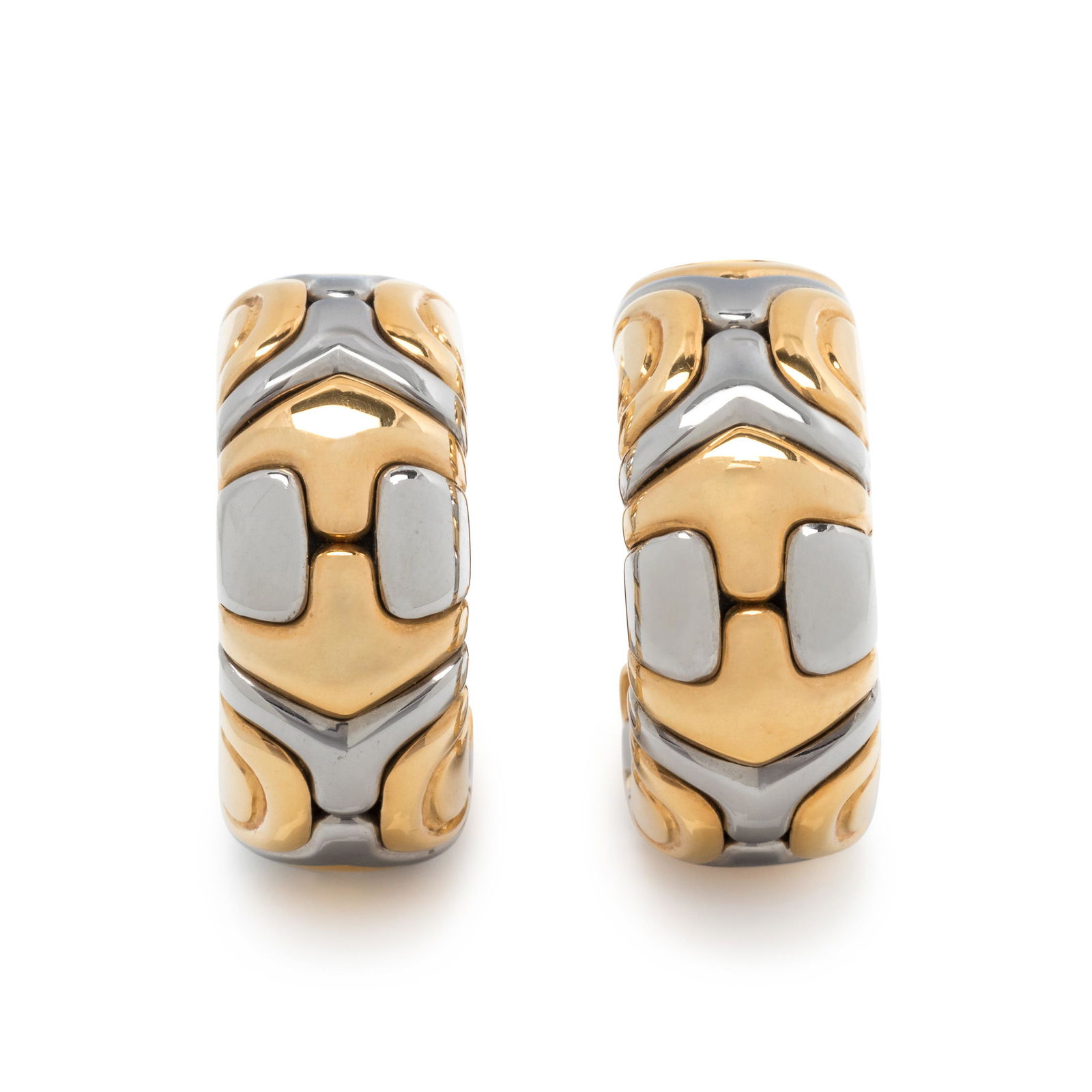 BVLGARI, YELLOW GOLD AND STEEL 'PARENTESI' EARCLIPS: BVLGARI, YELLOW GOLD AND STEEL 'PARENTESI' EARCLIPS Consisting of geometric yellow gold and steel links. 7/8 inch long. Stamp: 750 BVLGARI (Italian hallmark) MADE IN ITALY. 15.65 dwt.