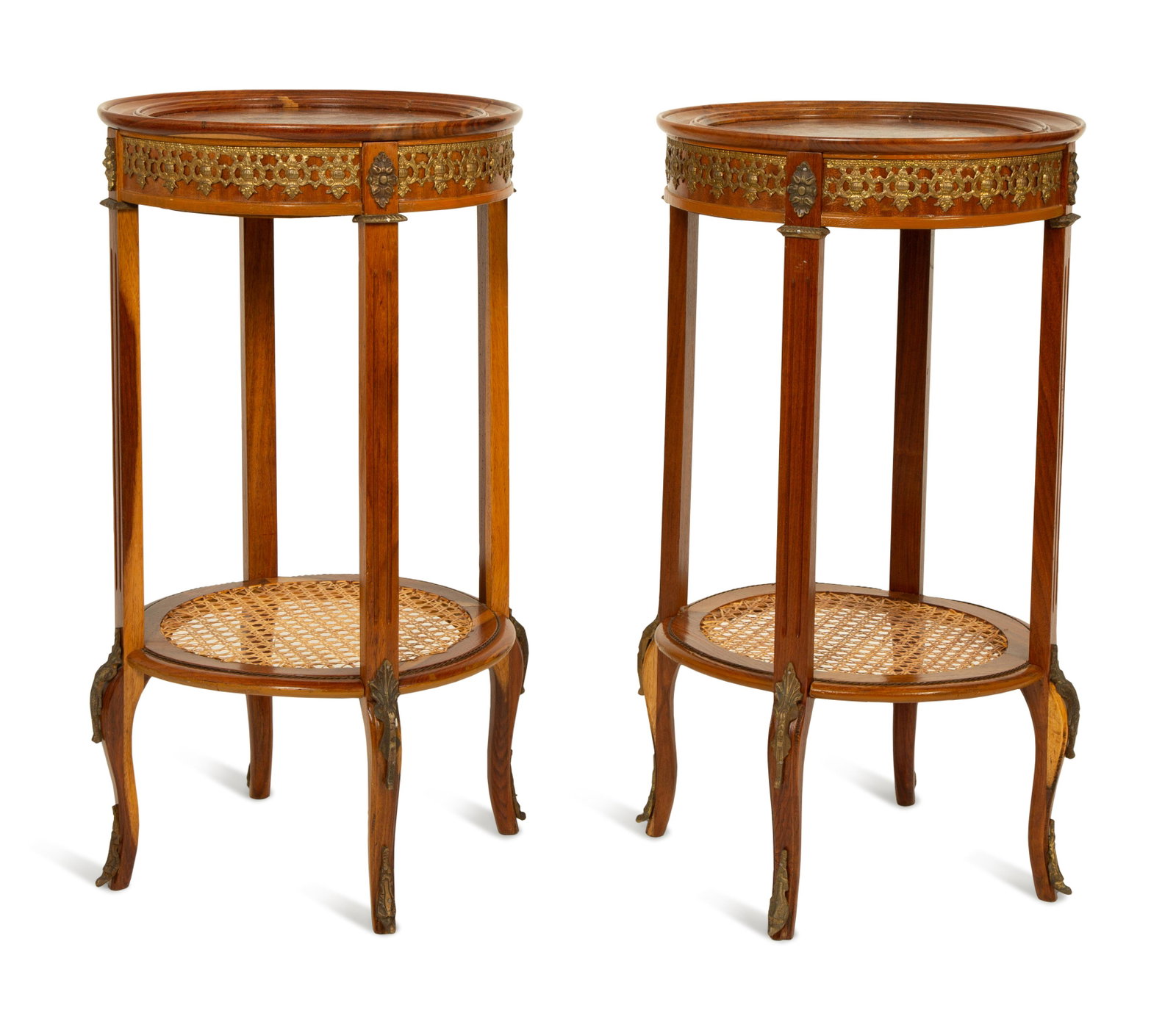A Pair of Louis XVI Style Gilt Metal Mounted and Inlaid: A Pair of Louis XVI Style Gilt Metal Mounted and Inlaid Gueridons 20TH CENTURY with caned stretcher shelf. Height 28 x diameter 15 1/2 inches. Property from the Estate of Jules and Gwen Knapp, Stuart,