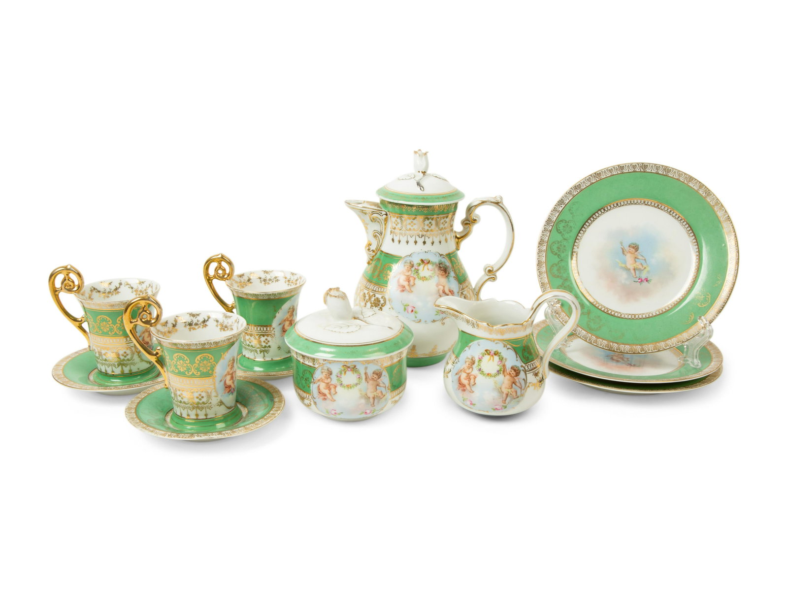 An Austrian Porcelain Tea Service: An Austrian Porcelain Tea Service 20TH CENTURY comprising; 3 teacups and saucers 3 chargers teapot creamer covered sugar 12 items total. Height of teapot 7 1/2 inches.
