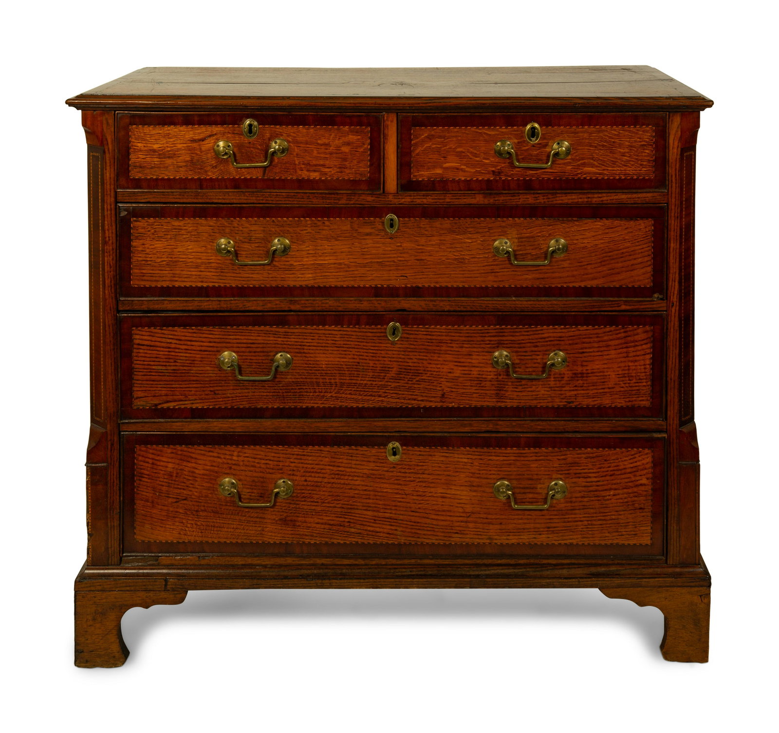 A George III Inlaid Oak and Mahogany Chest of Drawers: A George III Inlaid Oak and Mahogany Chest of Drawers 18TH/19TH CENTURY Height 40 x width 44 x depth 20 3/4 inches. Property from the Collection of a Prominent Family, John's Island, FL
