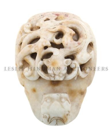 A Chicken Bone Jade Garment Hook, Length 2 5/8 inc: A Chicken Bone Jade Garment Hook, the hook with dragon head form, having raised kylin with linghzi fungus throughout the main panel. Length 2 5/8 inches. Property of a Private Midwest Collector