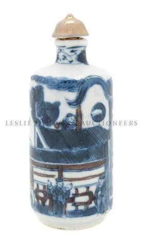 A Chinese Blue and White Porcelain Snuff Bottle, H: A Chinese Blue and White Porcelain Snuff Bottle, having underglazed blue and copper red decoration of figures in a court yard scene. Height of bottle 2 7/8 inches. The Leo and Doris Hodroff Collection