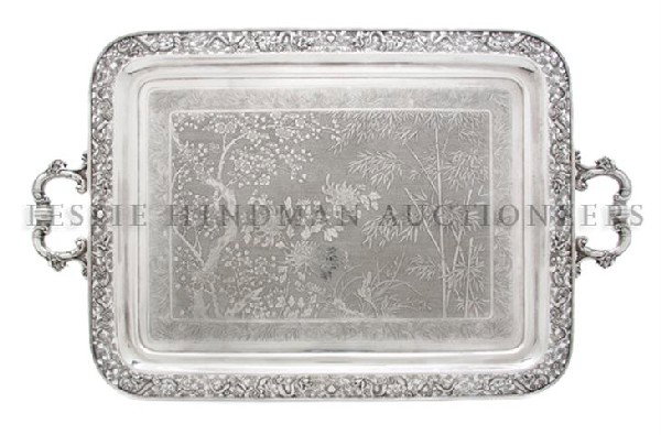 A Chinese Silver Export Tray, Wang Hing & Co., Wid: A Chinese Silver Export Tray, Wang Hing & Co., of rectangular form with the central panel depicting a foliate scene, the border containing pierce carved decoration of dragons amongst clouds with c-scr