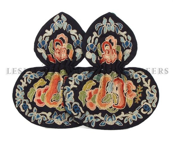 A Chinese Embroidered Double-Gourd Purse, Height o: A Chinese Embroidered Double-Gourd Purse, having navy colored satin reserve with embroidered border of blue bats and leaves surrounding the central polychrome embroidered panel of fruit. Height of pur