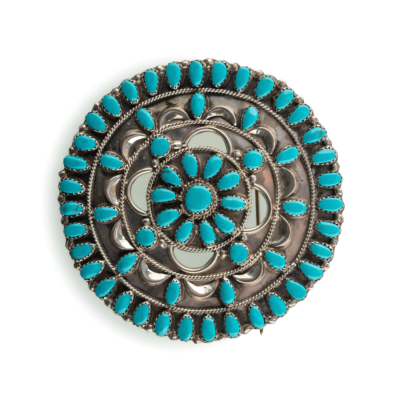 Navajo or Zuni Silver and Petit Point Turquoise Pin /: Navajo or Zuni Silver and Petit Point Turquoise Pin / Brooch third quarter 20th century not marked diameter 3 inches, weight 19.9 dwt. The Collection of Michelle Smith, Washington, D.C.