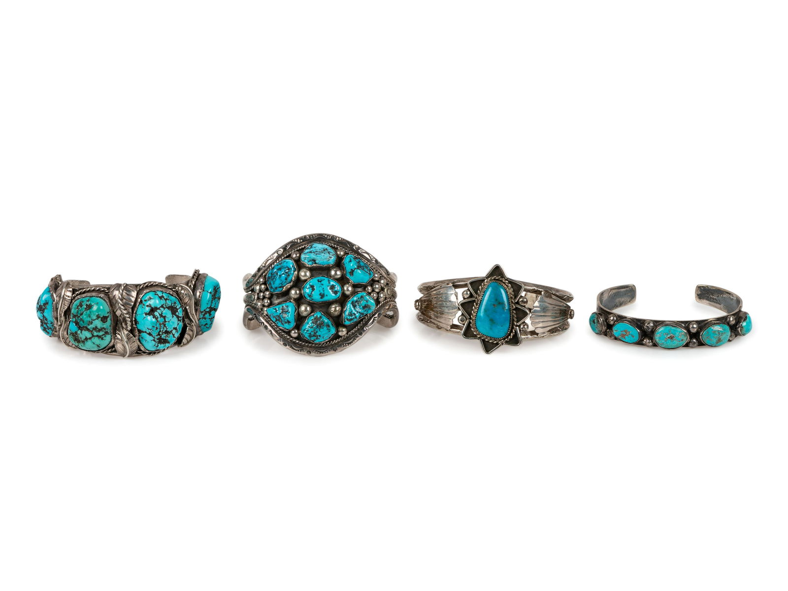 Navajo Silver and Turquoise Cuff Bracelets: Navajo Silver and Turquoise Cuff Bracelets third quarter 20th century lot of 4, includes: a silver cuff, set with a cluster of turquoise nuggets; marked MR cuff width 2 inches, interior circumference