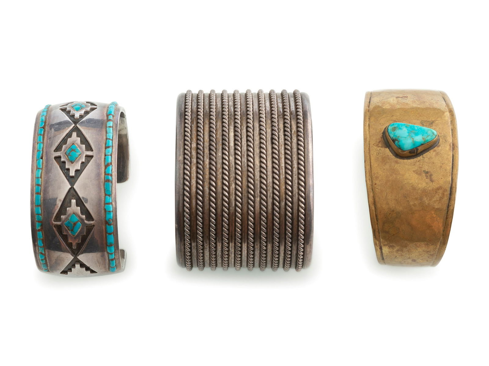 Navajo Cuff Bracelets: Navajo Cuff Bracelets third quarter 20th century lot of 3, includes: a silver cuff, with overlay geometric design, accented by turquoise inlay; not marked cuff width 1-1/8 inches, interior circumferen