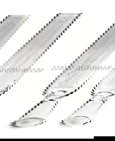 A Pair of Steuben Glass Vases, Height 13 inches.: A Pair of Steuben Glass Vases, models X2950F and X2950S, designed by Bruce Moore, 1956, each of cylindrical form with intaglio decoration depicting Tom Sawyer and Huckleberry Finn, having engraved sig