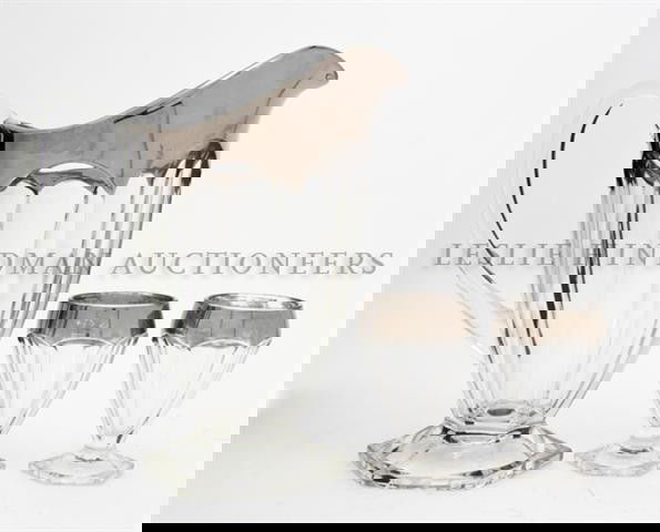 An Art Deco Style Silvered Glass Seven Piece Drink: An Art Deco Style Silvered Glass Seven Piece Drink Set, comprising a pitcher and six glasses. Height of first 10 1/8 inches.