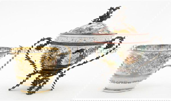 A Set of Two Teacups, Height of tallest 5 3/4 inch: A Set of Two Teacups, comprising one lidded cup with silver legs, handle and accents with figure of Pan on the lid, the other having overall floral gilt decoration and marked Spode 3502 on bottom. Hei