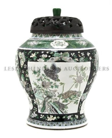 A Chinese Ginger Jar, Height overall 13 1/2 inches: A Chinese Ginger Jar, of baluster form, decorated with birds, fish and flowers, having pierce carved hardwood lid. Height overall 13 1/2 inches.
