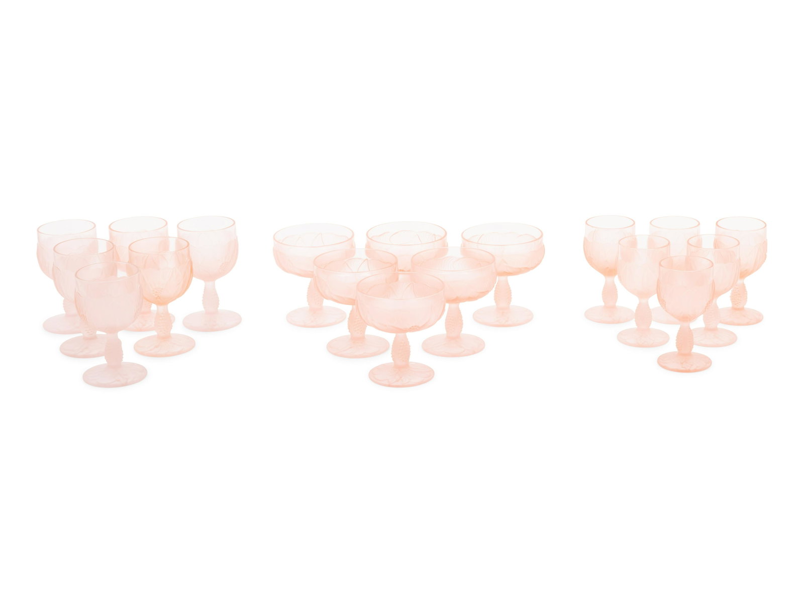 A Set of Pink Molded and Frosted Glass Stemware: A Set of Pink Molded and Frosted Glass Stemware Articles 20th Century comprising 22 coupes, 23 wine glasses and 20 claret wine glasses, each unmarked; 65 items total. Height of wine glasses 5 3/8 inch