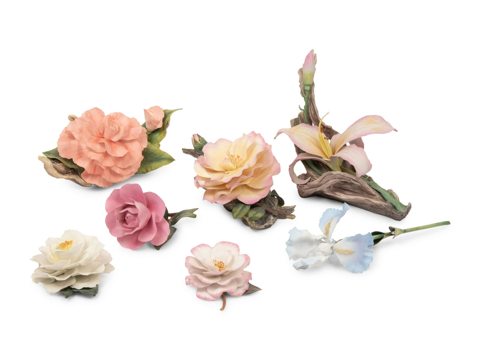 A Group of Seven Porcelain Flowers: A Group of Seven Porcelain Flowers 20th Century Length of longest example 12 1/2 inches. Property From The Estate of Edwin L. Cox, Dallas, Texas