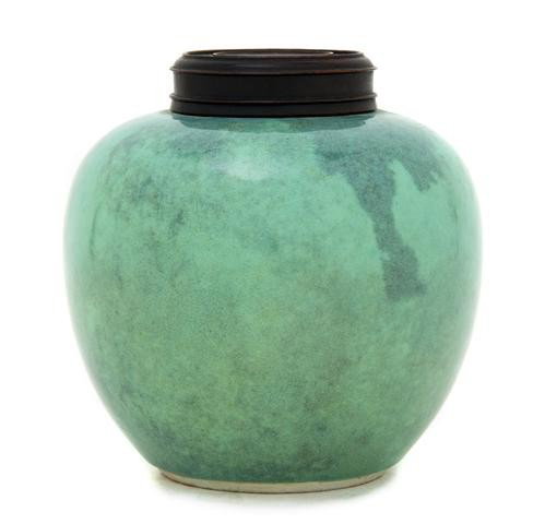 A Chinese Porcelain Ginger Jar, Height of vase 5 1: A Chinese Porcelain Ginger Jar, of bulbous form with opaque green glaze throughout, having a carved wood top. Height of vase 5 1/4 inches. Parke Bernet label