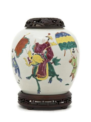A Chinese Famille Rose Ginger Jar, Height of jar 7: A Chinese Famille Rose Ginger Jar, having enameled decoration of a processional scene, with pierce carved wood lid and stand. Height of jar 7 1/2 inches.