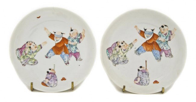 A Pair of Chinese Enameled Saucers, Diameter 5 1/2: A Pair of Chinese Enameled Saucers, Qing Dynasty, depicting boys at play in polychrome decoration, the backs decorated with iron red bats and having a four character reign mark. Diameter 5 1/2 inches.