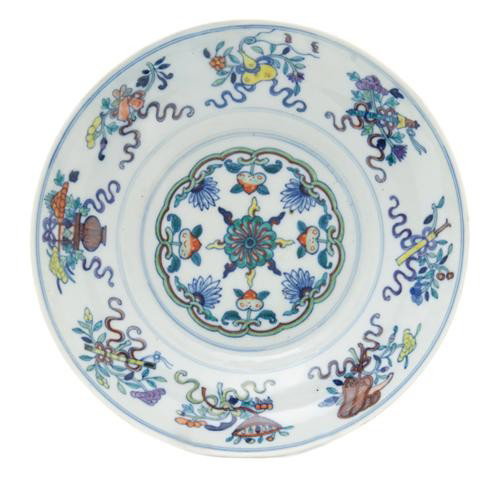 A Chinese Wucai Decorated Bowl, Diameter 8 1/8 inc: A Chinese Wucai Decorated Bowl, 19th century, the center having circular foliate decoration surrounded by a border of Buddhist emblems, the underside having a six character underglazed blue reign mark
