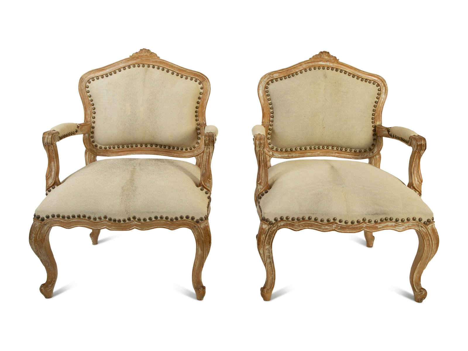 A Pair of French Provincial Fauteuils with Hide: A Pair of French Provincial Fauteuils with Hide Upholstery 20TH CENTURY Height 42 x width 28 1/2 x depth 29 inches.