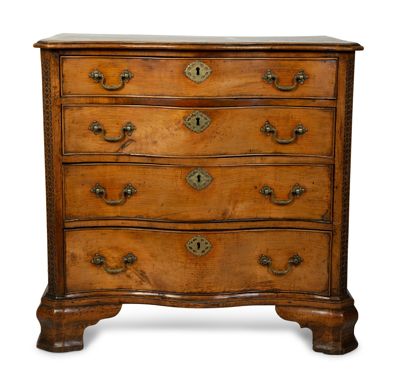 A George III Walnut Serpentine Chest of Drawers Height: A George III Walnut Serpentine Chest of Drawers 18TH CENTURY in the manner of Thomas Chippendale, with fret carved canted corners. Height 31 3/4 x width 33 x 21 inches. Collection of a Palm Beach Lady