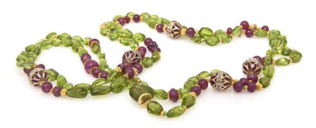 An 18 Karat Gold, Ruby, Peridot and Diamond Neckla: An 18 Karat Gold, Ruby, Peridot and Diamond Necklace, Verdura, consisting of five gold filigree sections each containing 16 marquise shape rubies and 15 round rose cut diamonds, five fluted gold ronde