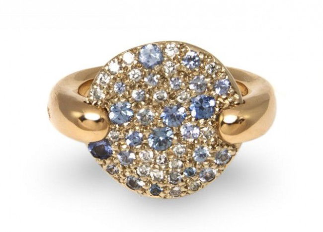 An 18 Karat Yellow Gold, Diamond and Blue Sapphire: An 18 Karat Yellow Gold, Diamond and Blue Sapphire Ring, Pomellato, containing 22 round brilliant cut diamonds weighing approximately 0.25 carat and numerous round brilliant cut sapphires of various s