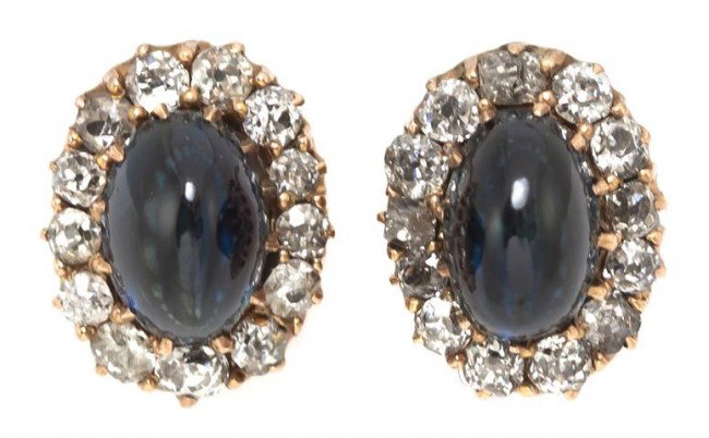 A Pair of Victorian 14 Karat Yellow Gold, Sapphire: A Pair of Victorian 14 Karat Yellow Gold, Sapphire and Diamond Earrings, containing two high dome oval cabochon cut sapphires measuring approximately 9.00 x 5.50 x 6.25 mm and 26 old mine cut diamonds