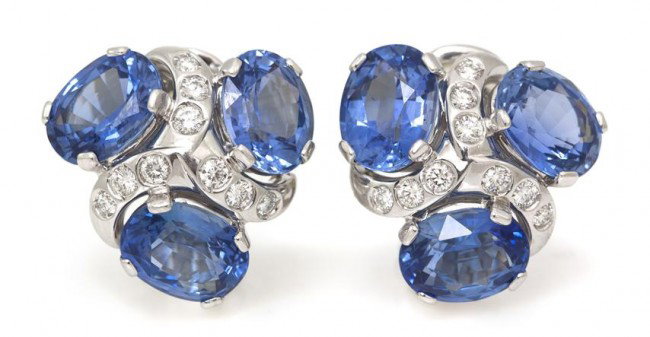 A Pair of Platinum, Sapphire and Diamond Spiral Ea: A Pair of Platinum, Sapphire and Diamond Spiral Earclips, Verdura, containing six oval brilliant cut sapphires weighing approximately 16.00 carats total and 18 round brilliant cut diamonds weighing ap