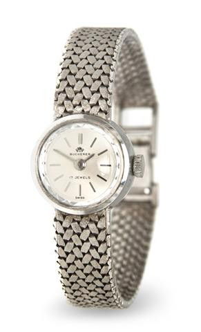 An 18 Karat White Gold Mechanical Wristwatch, Buch: An 18 Karat White Gold Mechanical Wristwatch, Bucherer, 16.00 mm case diameter, matte silvered dial, baton numerals, silvered baton hands, snap on case back, 17 jewel manual wind movement, textured me