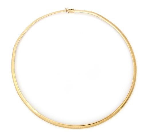 A 14 Karat Yellow Gold Omega Necklace, 9.15 dwts.: A 14 Karat Yellow Gold Omega Necklace, measuring approximately 4.80 mm in diameter. Stamp: 14K ITALY MILOR. Length 18 inches. 9.15 dwts. Property from the Estate of Bernice S. Rosen, Chicago, Illinois