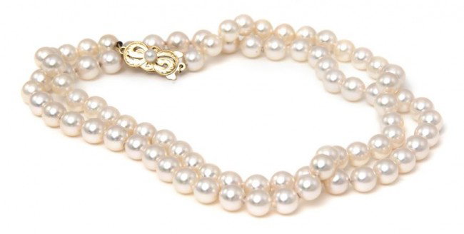 A Single Strand Cultured Pearl Necklace, Mikimoto,: A Single Strand Cultured Pearl Necklace, Mikimoto, containing pearls measuring approximately 6.50 - 7.00 mm in diameter strung knotted with an 18 karat yellow gold openwork clasp containing one pearl 