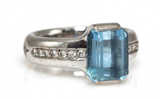 An 18 Karat White Gold, Aquamarine and Diamond Rin: An 18 Karat White Gold, Aquamarine and Diamond Ring, H. Stern, containing one octagonal step cut aquamarine weighing approximately 3.25 carats and 16 round brilliant cut diamonds weighing approximatel