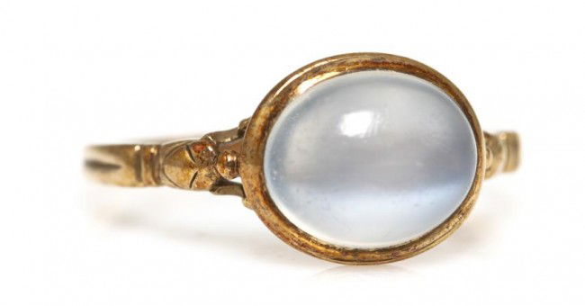 A 14 Karat Yellow Gold and Moonstone Ring, 2.00 dw: A 14 Karat Yellow Gold and Moonstone Ring, containing one oval cabochon cut moonstone measuring approximately 10.00 x 8.00 mm. Size 6 1/4. 2.00 dwts.